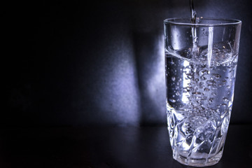 Glass of water isolated back background. Water was poured into the Glass. With copy space.