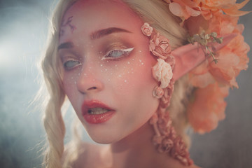 Young beautiful girl. Attractive elf close-up.