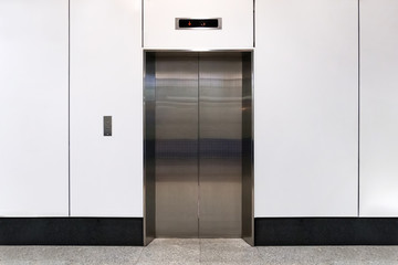 An empty modern elevator or lift with metal doors © diy13