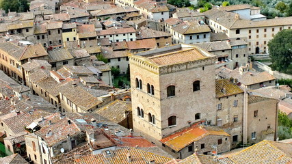 Fototapeta na wymiar Old style rooftops and roof tiles in Italy