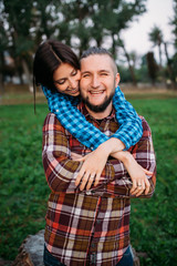 Walk a guy and a girl. Love story in the forest. Youth in nature.