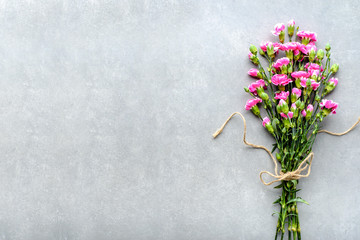 Spring flowers bouquet on gray background, mothers day card or wedding invitation with copy space