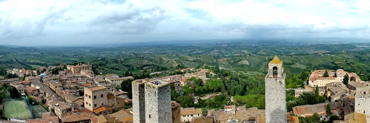 Fototapeta na wymiar Panoramic view of medieval towers and terracotta rooftops in iconic San Gimignano, Tuscany, Italy