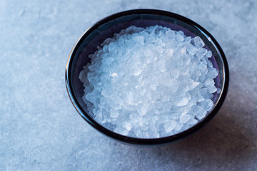 Lemon Sea Salt Crystals on Blue Surface.