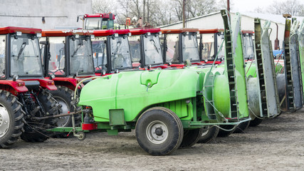 Fototapeta na wymiar tractor with trailers on the farm