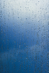 water drops of rain on a window glass. Rainy day