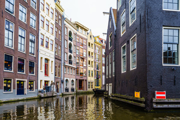 Fototapeta na wymiar Amsterdam canals and typical dutch houses in capital of Netherlands, Europe