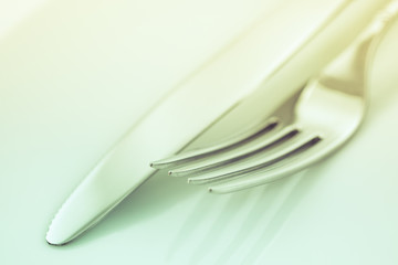 Fork and knife on a white background