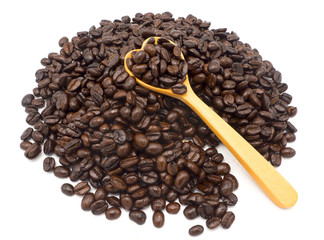 organic black coffee beans and wood spoon isolate top view on white background, make for refresh body because it is cafeine