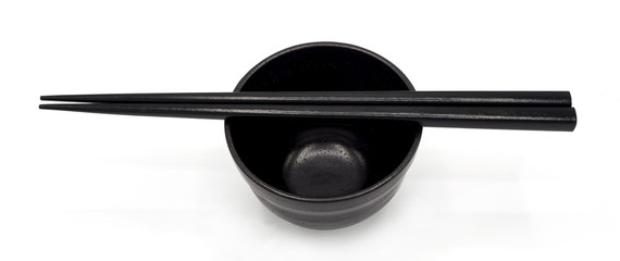 black Japanese chopsticks and bowl isolated on white background. for tong the food and put the rice