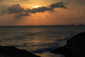 fishing boat to the sea at sunset