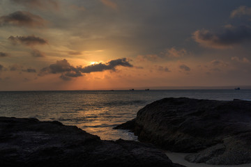 fishing boat to the sea at sunset