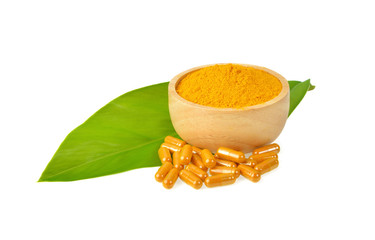 Turmeric powder and capsules  on white background