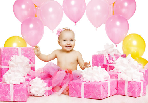 Baby Girl with Pink Present Gift Boxes, Kid Celebrating Birthday, Happy Child One Year Old Sitting in Balloons