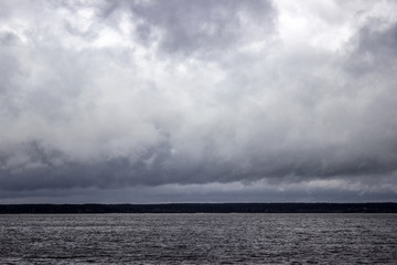 grey rainy clouds on the sea