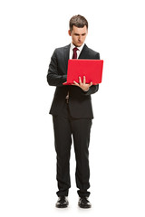 Full body portrait of businessman with laptop on white
