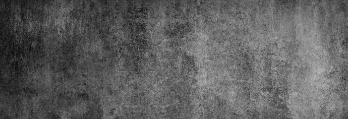 Textur einer fast schwarzen Betonwand in XXL-Größe als Hintergrund, auf die ein wenig Licht fällt - obrazy, fototapety, plakaty