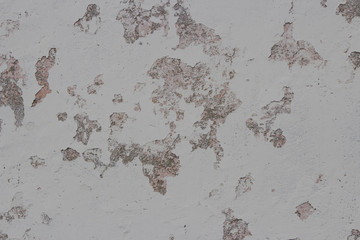 Peeling plaster on the wall