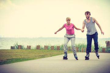 roller skater couple skating outdoor