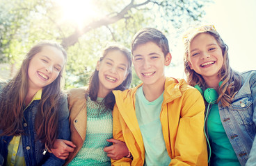 friendship and people concept - group of happy teenage students or friends outdoors