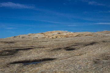 horizon seen by the stones of the beach of the harpooner in the city of rio de janeiro beautiful landscape with natural colors