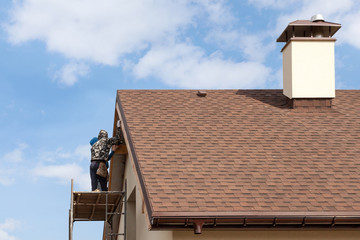 Roofing construction and building new house with modular chimney, skylights, attic, dormers and...