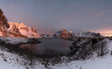 Fototapeta na wymiar Reine Village in the morning with stunning sunrise scene of the day one of the most famous village in Lofoten , Norway / Travel concept / Landscape Photography