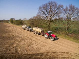 aerial view of a tractor with a trailer with liquid fertilizer