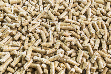 Solid Wood Pellets Background. Pressed Pellet made of Wood. Ecology and Heating season