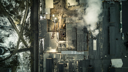 Aerial view from drone on the industrial factory. Smoke from pipeline.