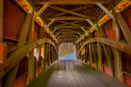 Indoor view of details of red covered bridge inside of the forest in Lancaster