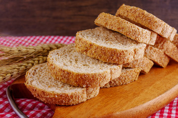 Sliced breads on wooden plate