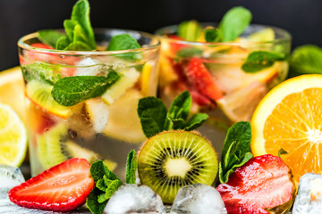Homemade lemonade with fruit and mint
