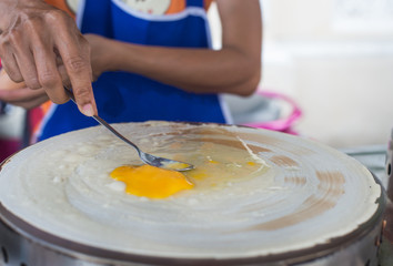 Making crispy crape with egg on stove,Thailand street food,pancake,sweet dessert
