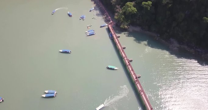 Reverse tilt shot of Dayang Bunting island landscape and docks. Aerial view.