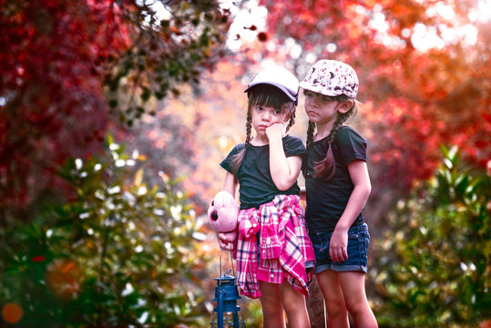 twin girls lost the way in forest, fear and worry for the evening attack at darkess of the night