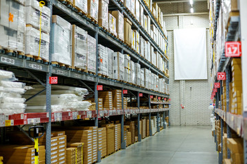 Warehouse, storage room in a large store. Laid out the goods on the shelves