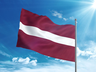 Fototapeta na wymiar Latvia flag waving in the blue sky 3D illustration
