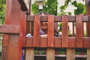 The girl is playing in the park.