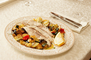 Fish fillet baked with vegetables