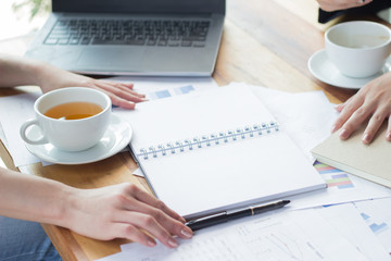 Young woman sit working in a coffee shop,Employees are working outside the company,Students are searching for reports at the restaurant,The girl is shopping online.
