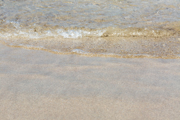 Soft wave of the sea on the sandy beach