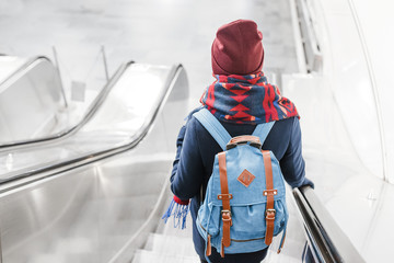 People stand on the escalator in the metro or subway, the concept of public urban underground...