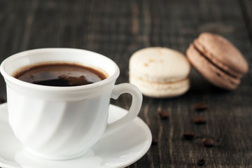 a cup of coffee and macaroons