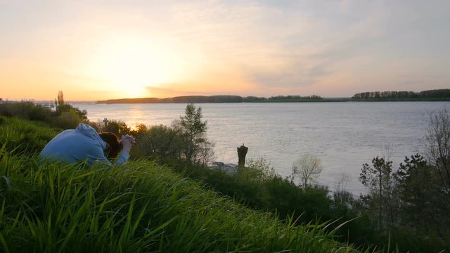 Man Worshiping And Praying On A Hill At Sunrise