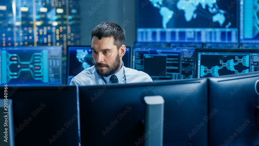 Poster In the System Control Center Operator Working Surrounded by Displays Showing Relevant Data. In the Background Data with Interactive Map.