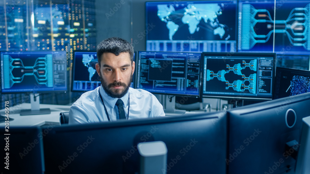 Poster Monitoring Room Technical Operator Observes System Stability. He's Surrounded By Screens Showing Technical Data.