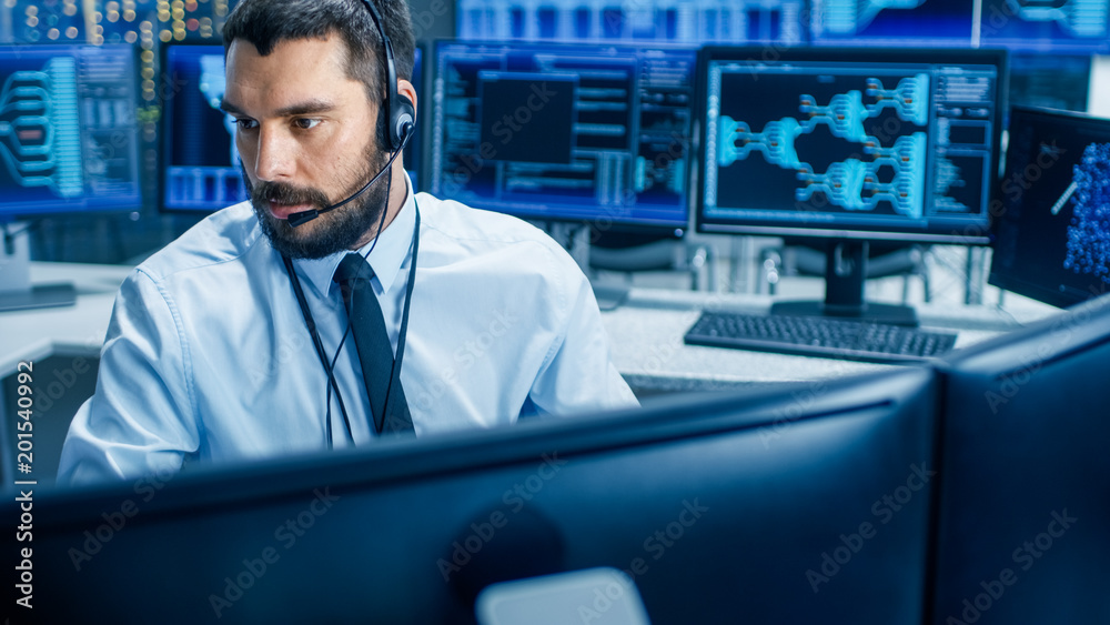 Poster In the System Monitoring Room Dispatcher Wearing Headset Observers Proper Functioning of the Facility. He's Surrounded by Screen Showing Technical Data.