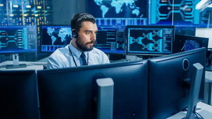 In the System Monitoring Room Dispatcher Wearing Headset Observers Proper Functioning of the...