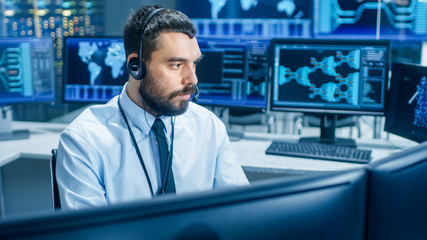 In the System Monitoring Room Dispatcher Wearing Headset Observers Proper Functioning of the...